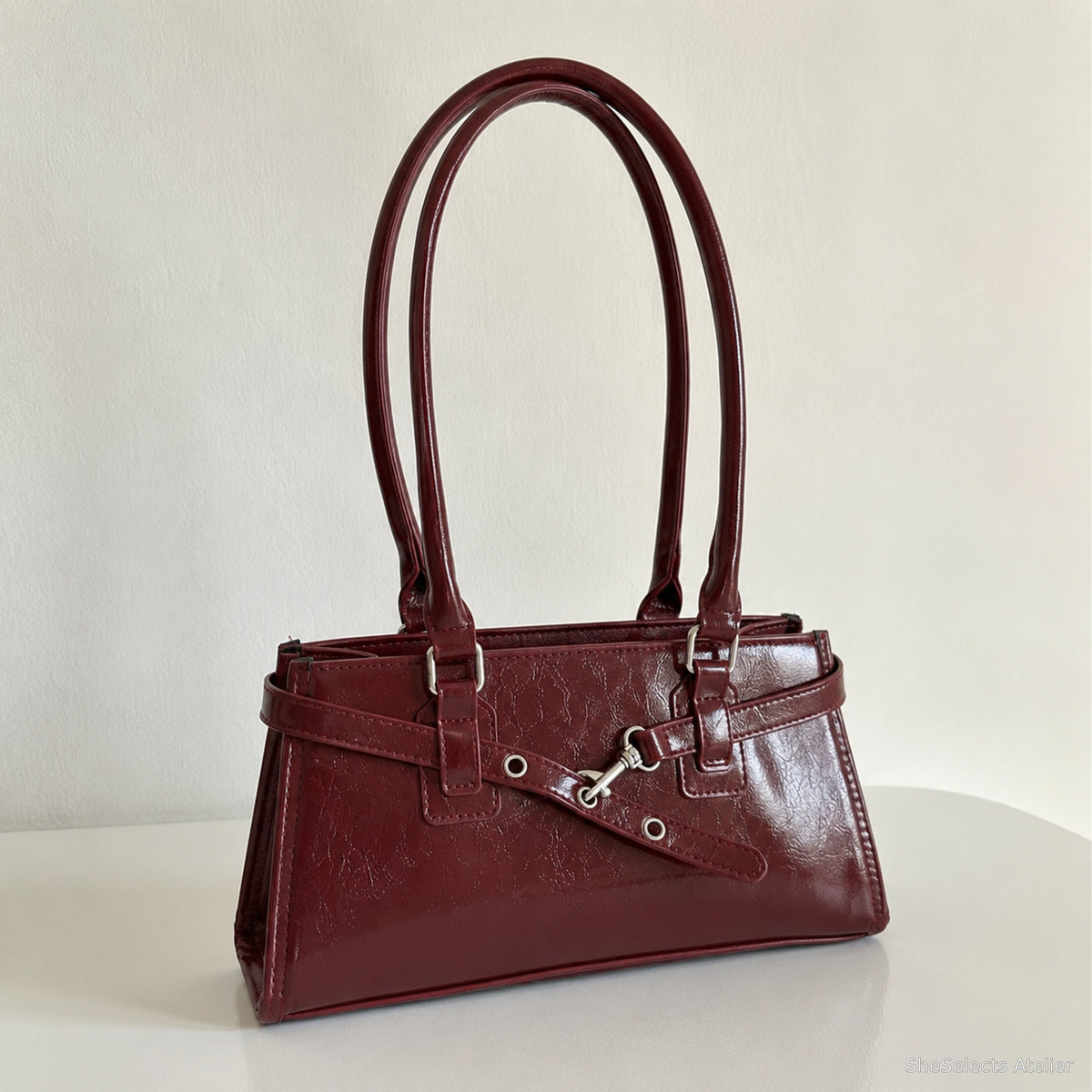 Burgundy glossy vegan leather east west baguette shoulder bag front view