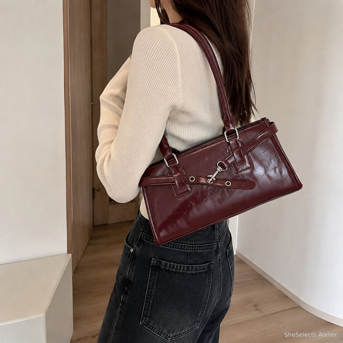Burgundy east west baguette bag worn on the shoulder