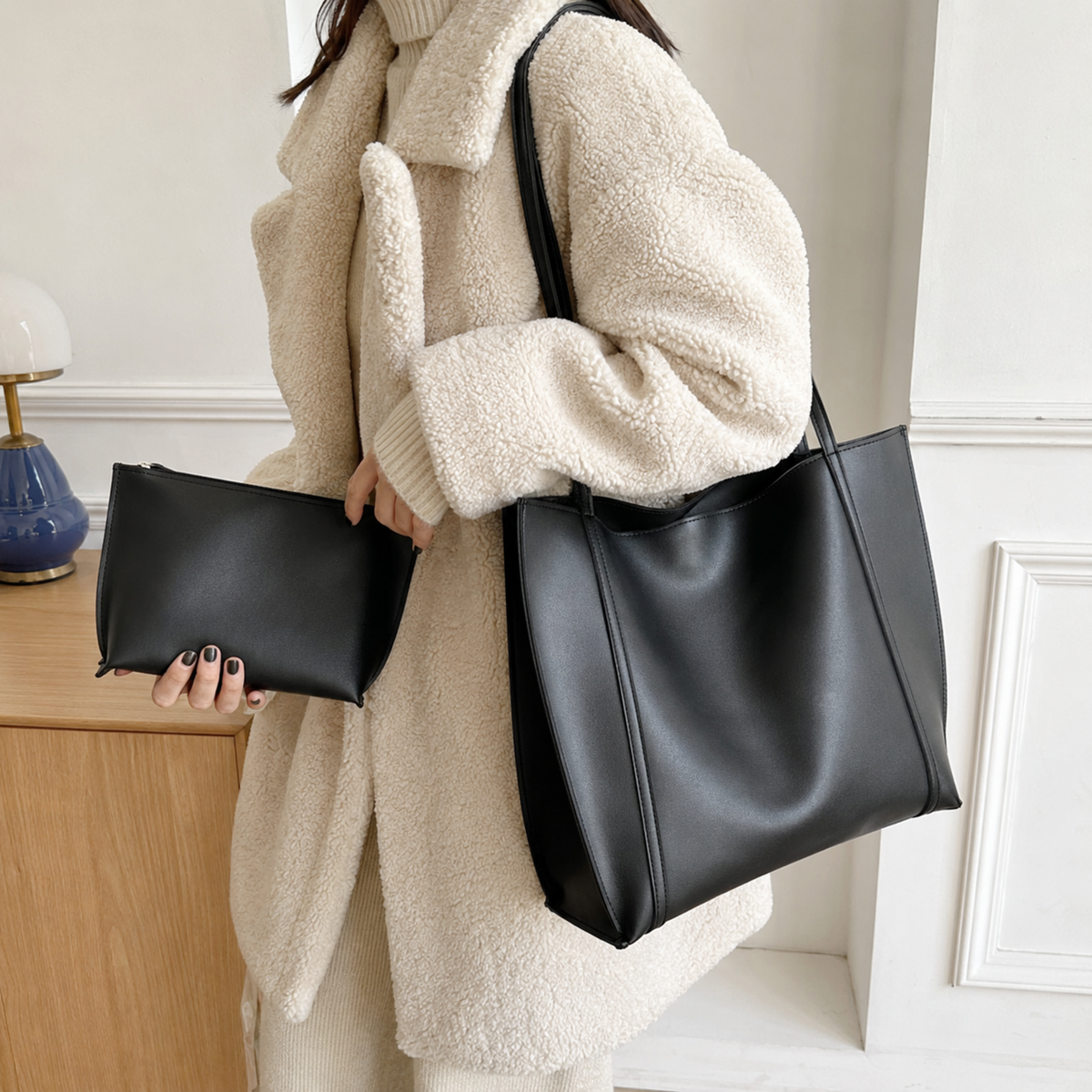 Black large work tote with matching pouch worn on the shoulder