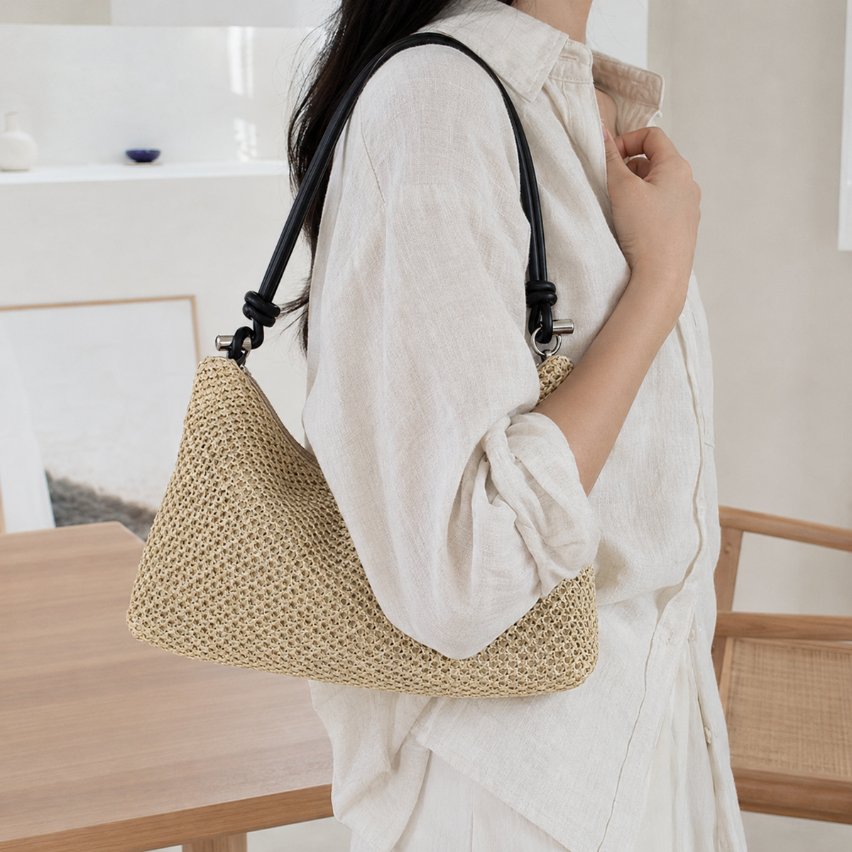 Natural straw shoulder hobo worn with brown knotted handle