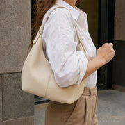 Dumpling Shoulder Bag, Textured Crescent Underarm Purse in Five Colors | model apricot | SheSelects Atelier