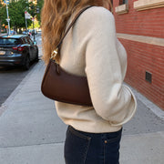 Minimalist Crescent Shoulder Bag, Small Vegan Leather Purse with Gold Chain Detail | model dark brown | SheSelects Atelier