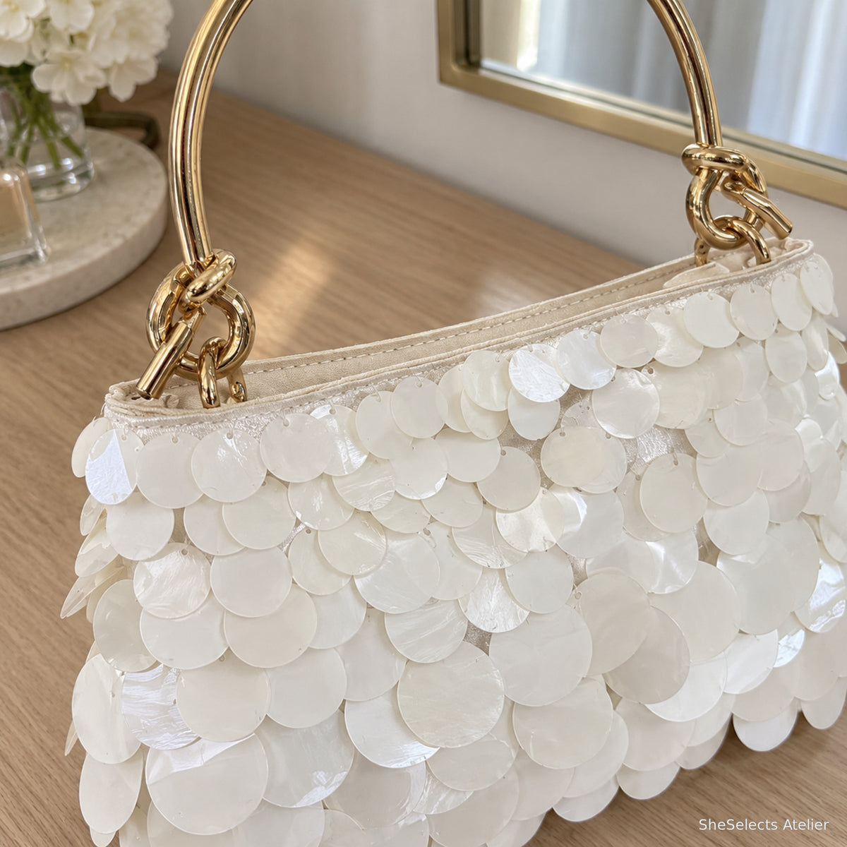 Pearlescent acrylic disc texture and gold handle detail