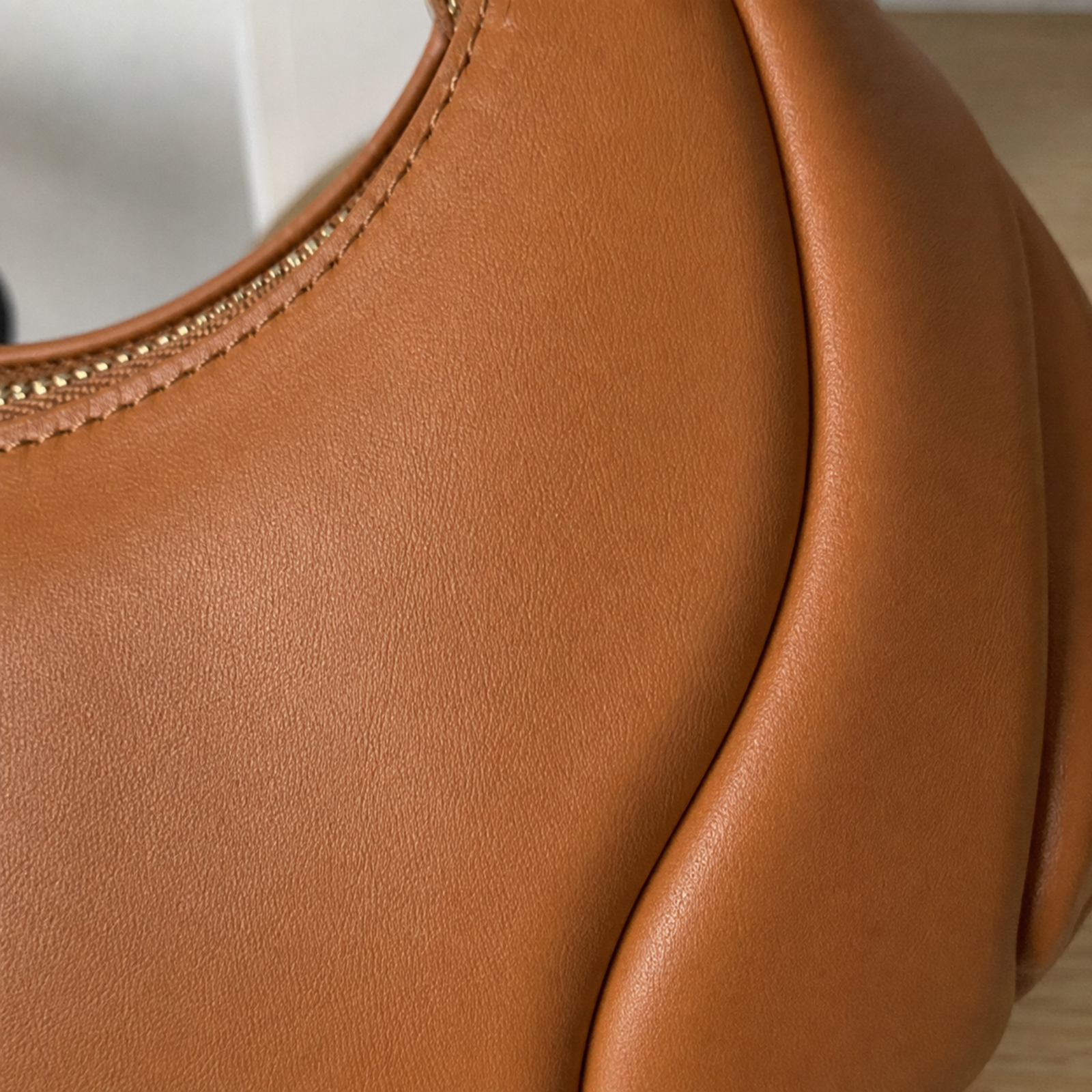 Close-up of smooth vegan leather and raised petal seam detail