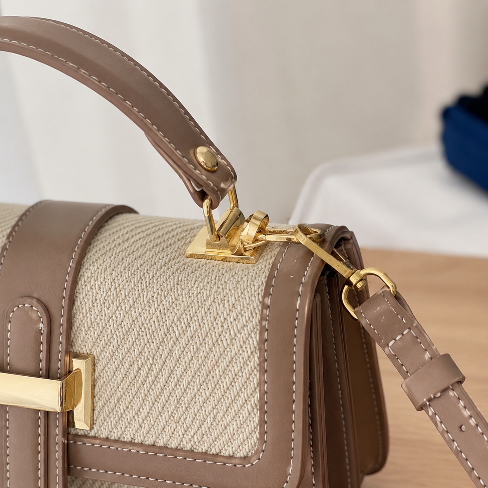 Close-up of the top handle mount and detachable shoulder strap hardware