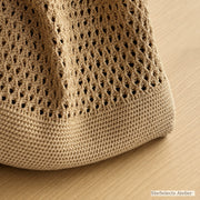 Close-up of khaki knit tote base and dense ribbed bottom band