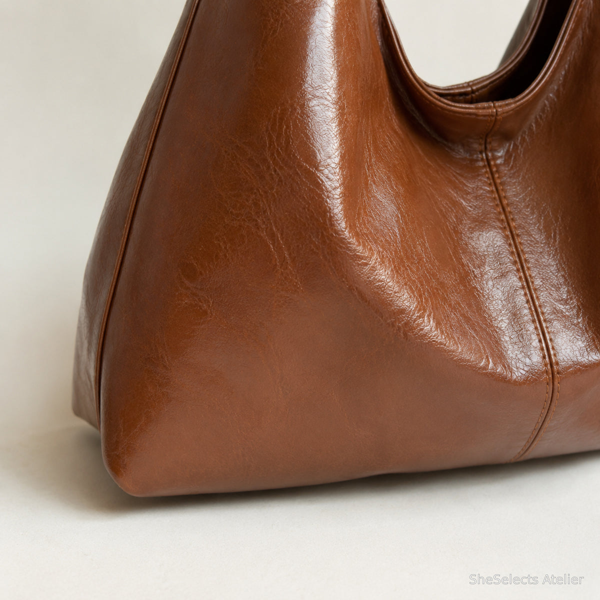 Close view of the caramel brown corner construction and softly crinkled finish