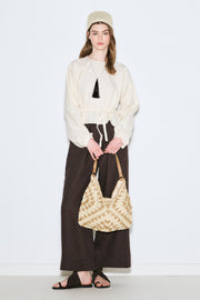 Beige patterned straw handbag with snap closure and inner pocket, view 2