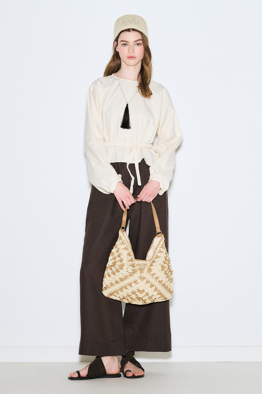 Beige patterned straw handbag with snap closure and inner pocket, view 2