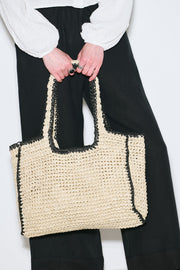 Large beige and black striped straw shoulder bag with zipper closure, view 3