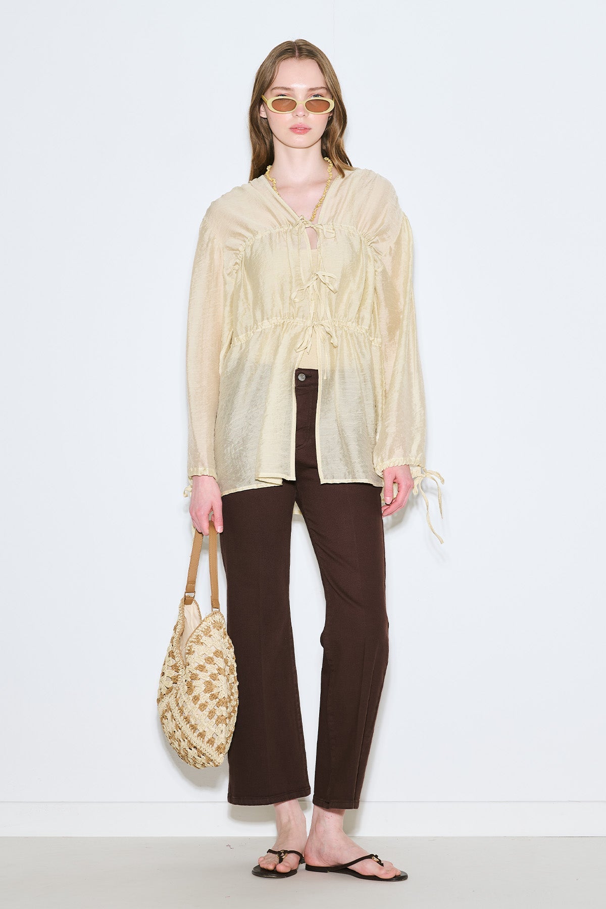 Beige patterned straw handbag with snap closure and inner pocket, view 4