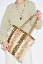 Beige striped straw shoulder bag with faux leather strap, view 1