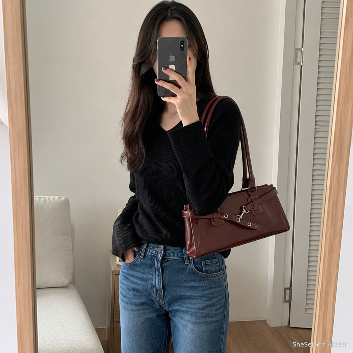 Burgundy glossy east west shoulder bag in a casual mirror style photo