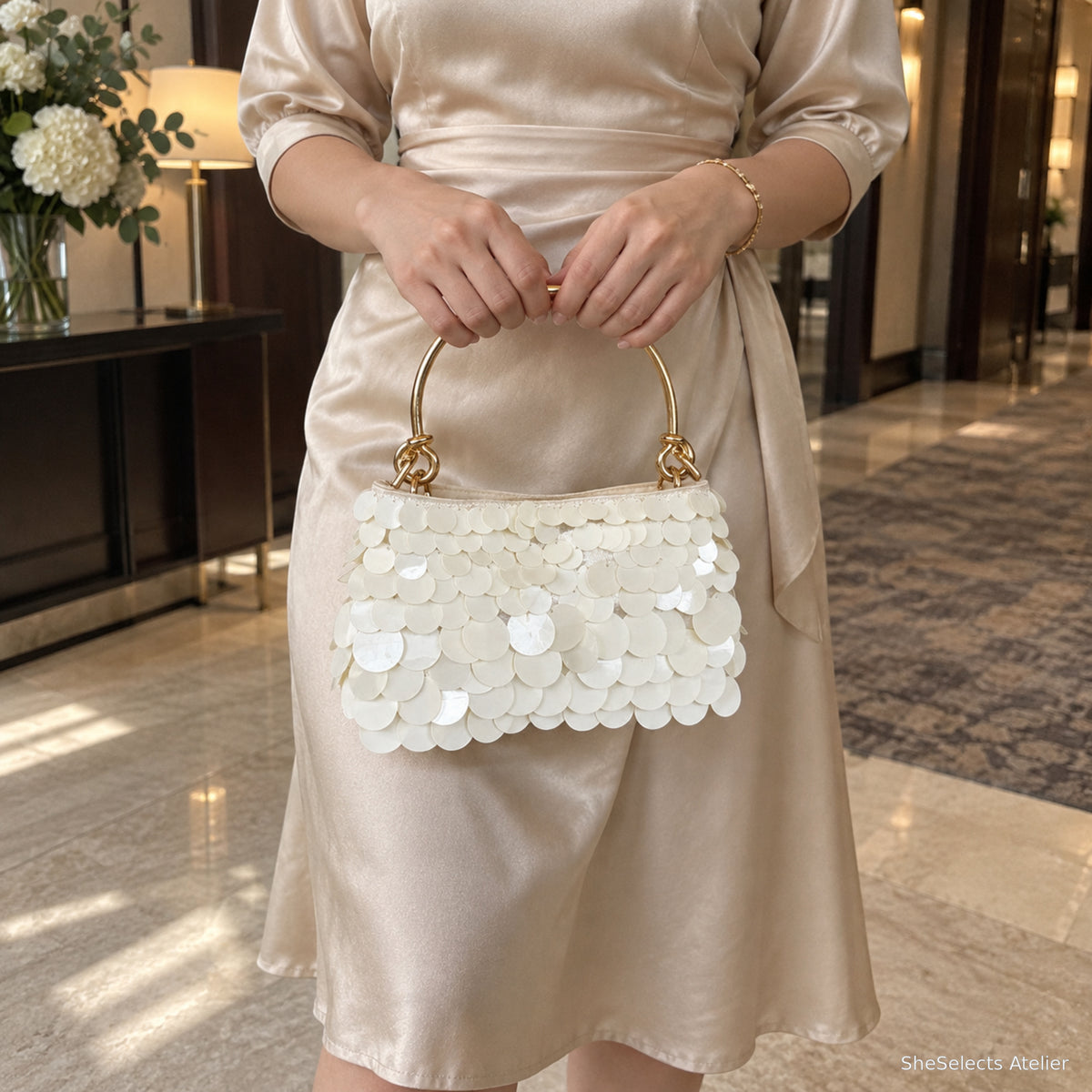 Bridesmaid holding Celestine evening handbag