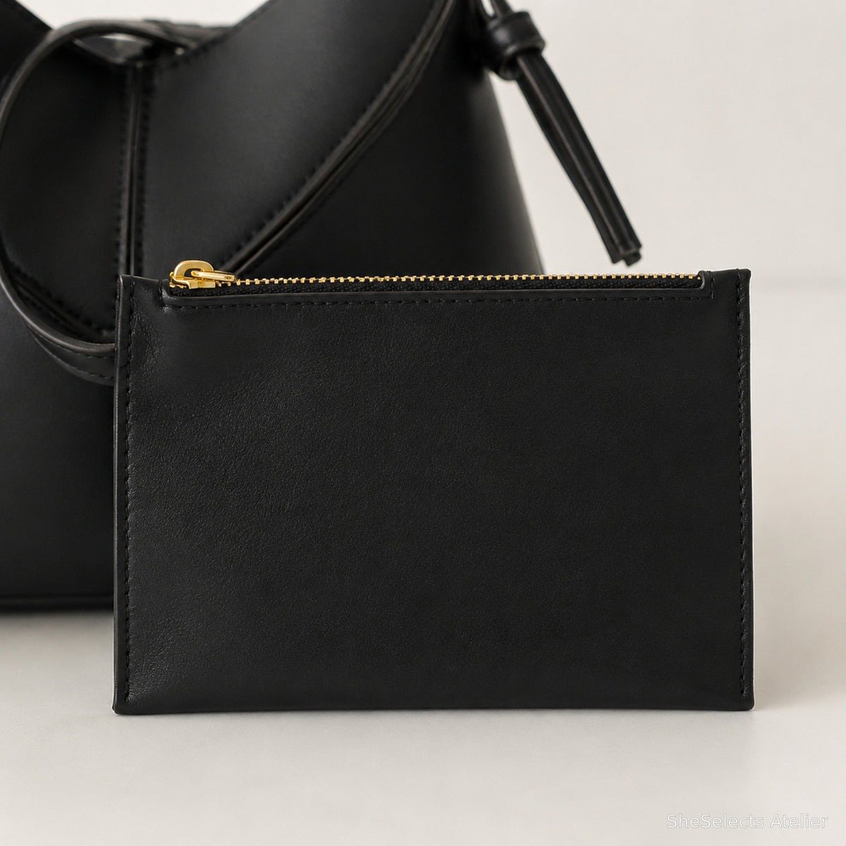 Matching black vegan leather zip pouch close-up