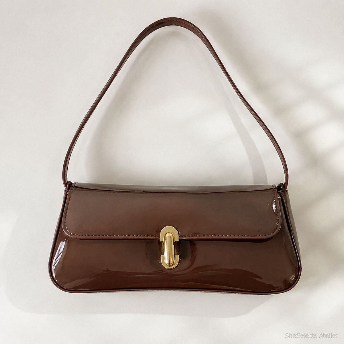 Brown glossy vegan leather baguette shoulder bag front view