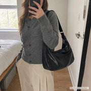 Natural customer mirror selfie with the black shoulder bag