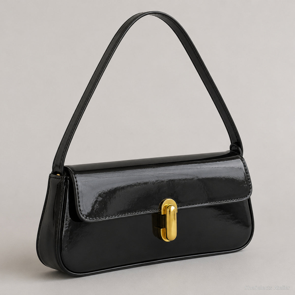 Black glossy vegan leather baguette bag three-quarter side view