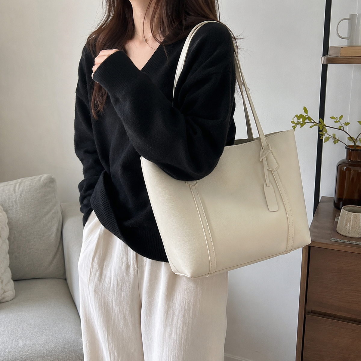 Large vegan leather work tote with zipper divider and structured shoulder shape