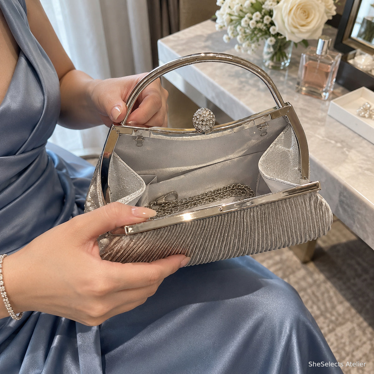 Open Celestine Silver bag showing satin lining pockets and chain