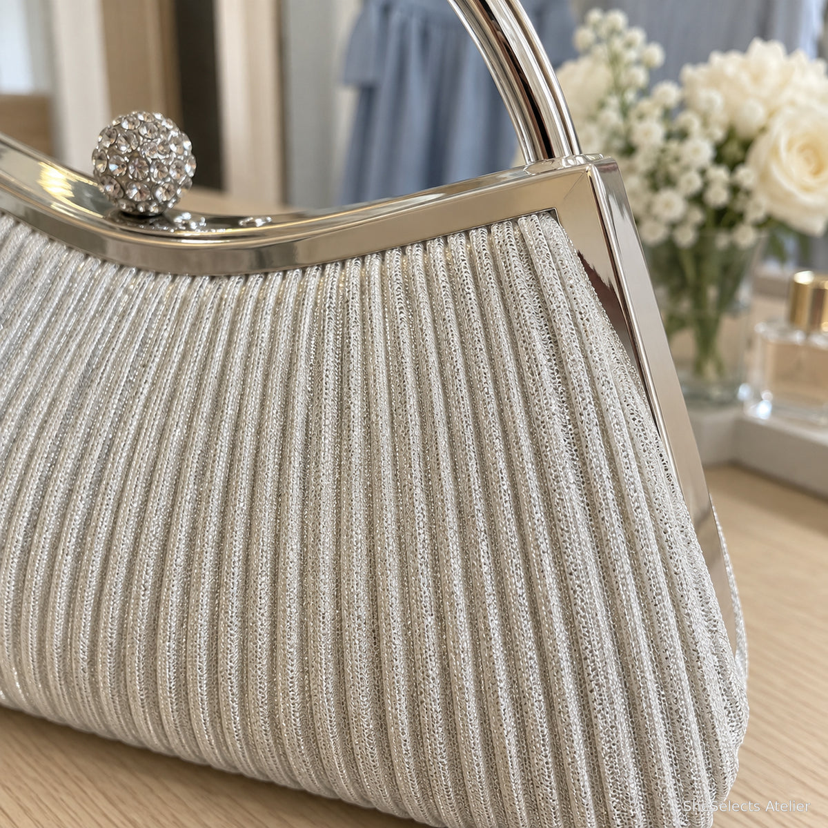 Close view of the Celestine Silver pleated metallic fabric texture