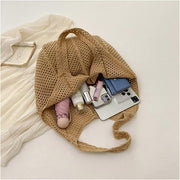 Crochet Tote Bag for Women, Woven Summer Beach and Vacation Purse in Black, styled as a SheSelects summer accessory