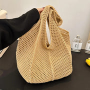 Crochet Tote Bag for Women, Woven Summer Beach and Vacation Purse in Black, styled as a SheSelects summer accessory