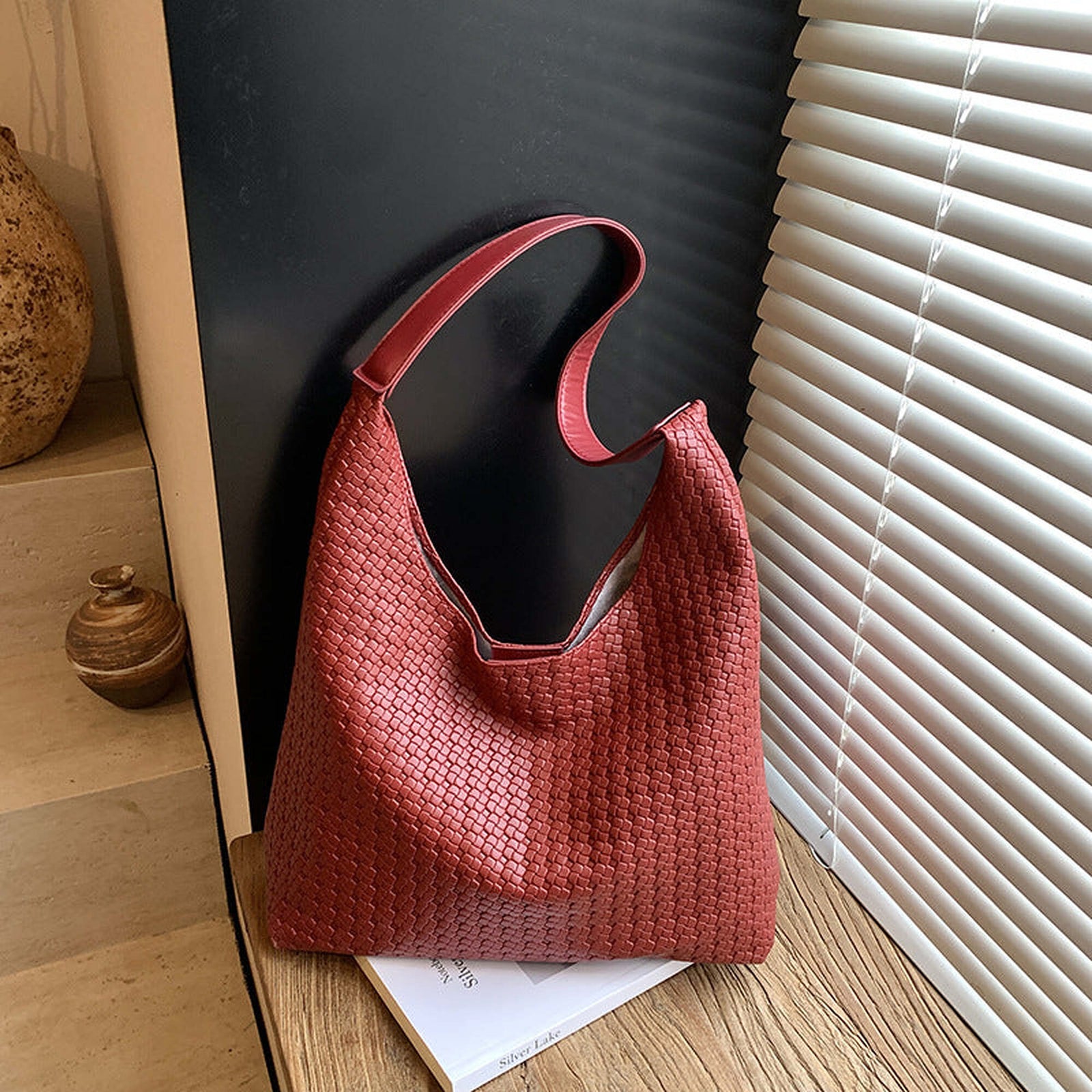 Red woven vegan leather hobo bag showing the exact soft slouchy shape