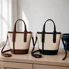 Strukturierte Canvas-Bucket-Bag mit Reißverschlussfächern und Crossbody-Riemen