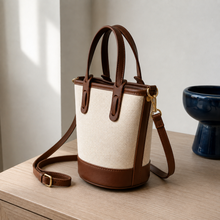 Strukturierte Canvas-Bucket-Bag mit Reißverschlussfächern und Crossbody-Riemen