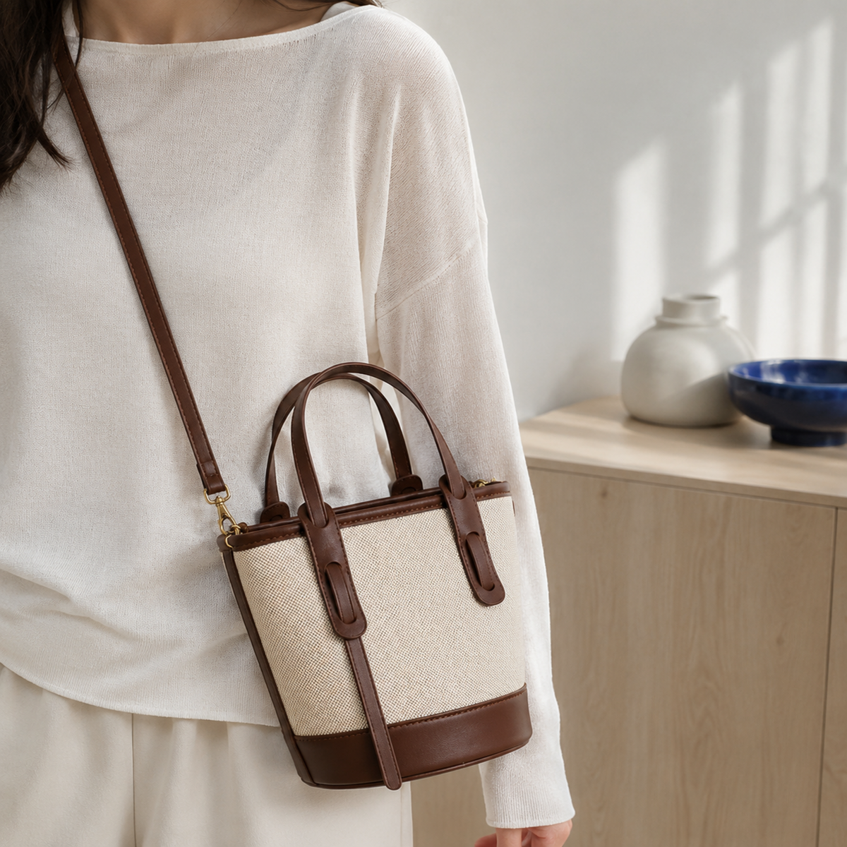 Brown canvas bucket bag styled crossbody