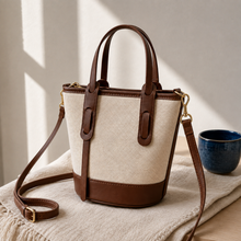 Strukturierte Canvas-Bucket-Bag mit Reißverschlussfächern und Crossbody-Riemen