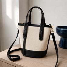 Strukturierte Canvas-Bucket-Bag mit Reißverschlussfächern und Crossbody-Riemen