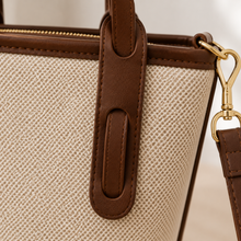 Strukturierte Canvas-Bucket-Bag mit Reißverschlussfächern und Crossbody-Riemen