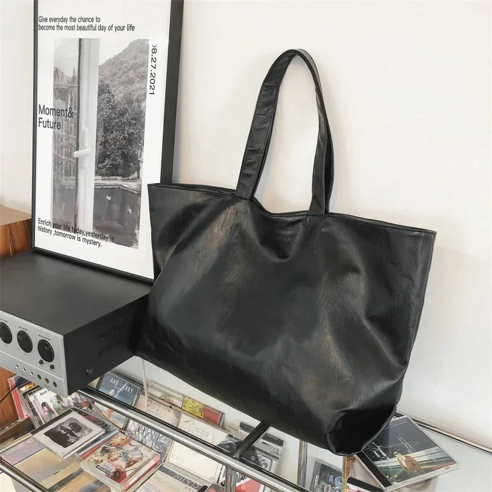 Large Vegan Leather Tote Bag for Women, Soft Everyday Shoulder Purse in Black, styled as a SheSelects summer accessory