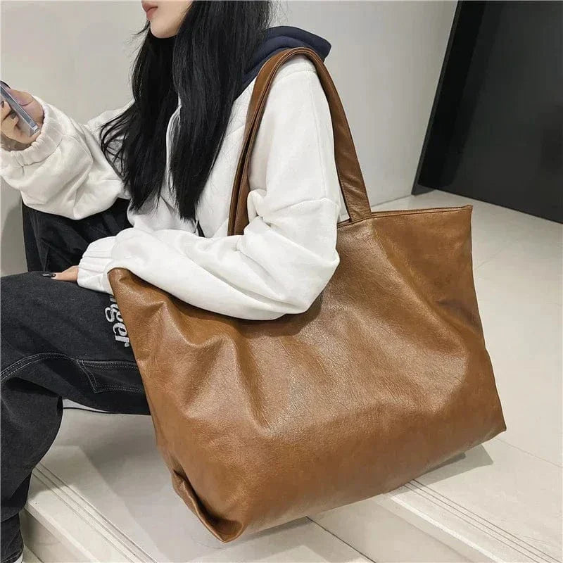 Large Vegan Leather Tote Bag for Women, Soft Everyday Shoulder Purse in Black, styled as a SheSelects summer accessory