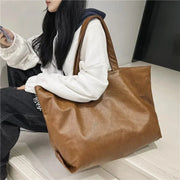 Large Vegan Leather Tote Bag for Women, Soft Everyday Shoulder Purse in Black, styled as a SheSelects summer accessory