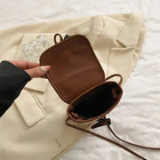 Mini Straw Summer Bag for Women, Natural Summer Vacation Purse in Light Brown, styled as a SheSelects summer accessory