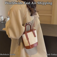 Strukturierte Canvas-Bucket-Bag mit Reißverschlussfächern und Crossbody-Riemen
