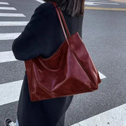 Vegan Leather Tote Bag for Women, Soft Everyday Shoulder Purse in Wine Red, styled as a SheSelects summer accessory