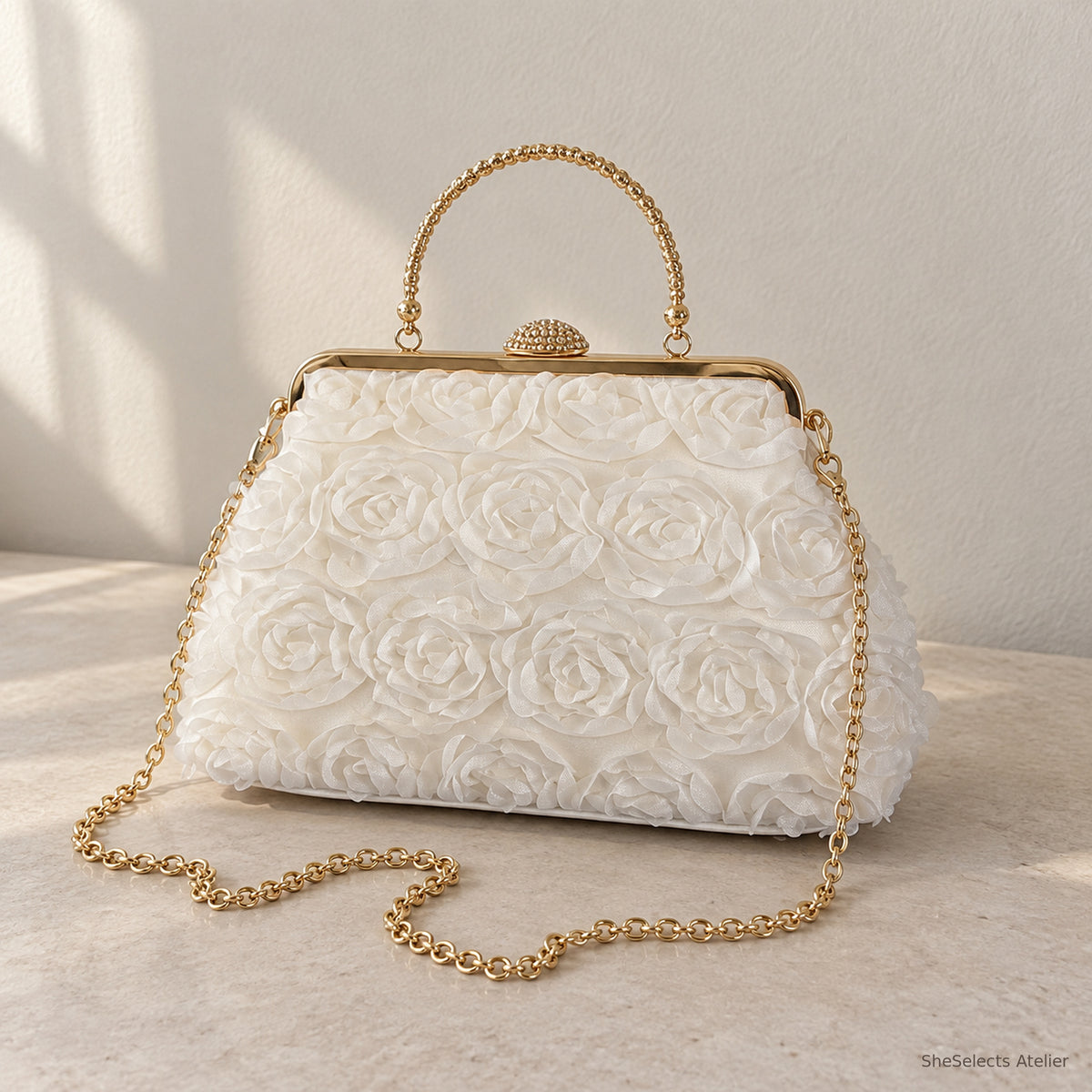 Ivory white floral rosette handbag with gold handle and chain, front view