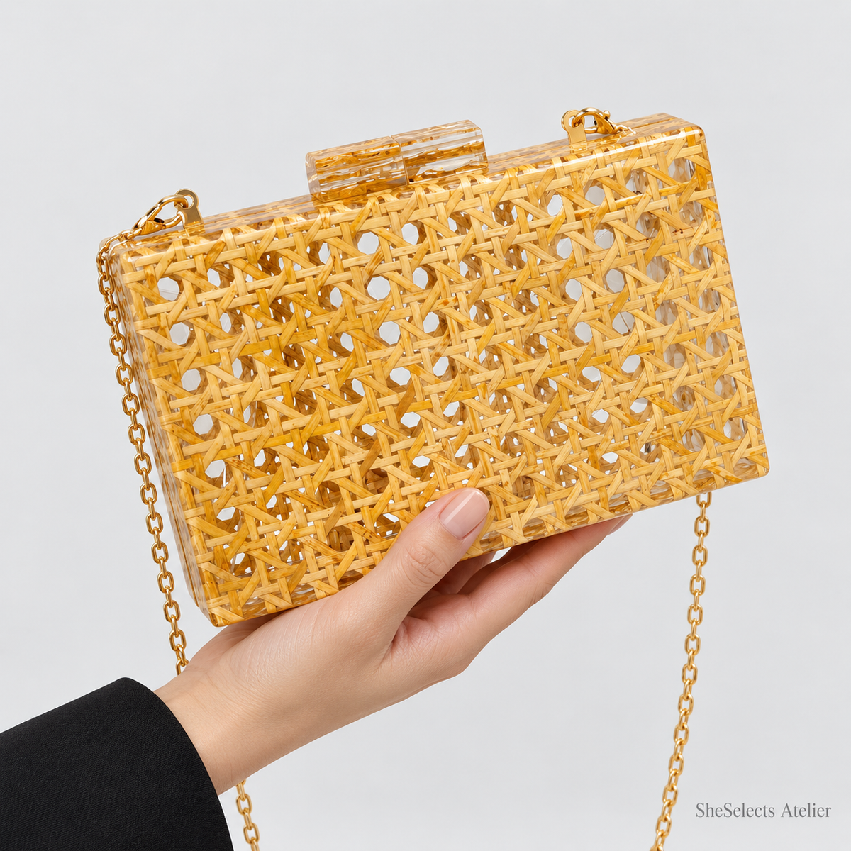 Close-up of the Aurelia evening bag held in one hand