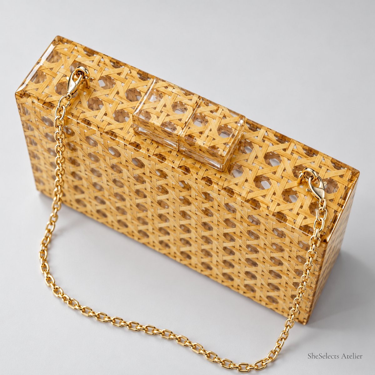 Top view of the acrylic clasp and gold-tone chain attachments