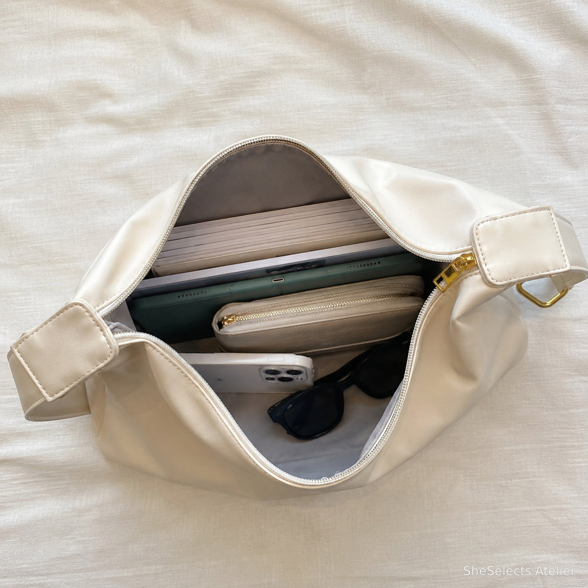 Creamy White hobo bag capacity view with work essentials