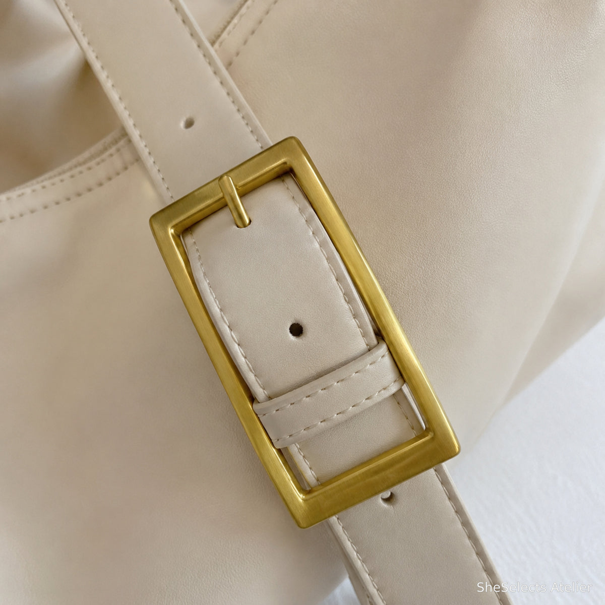 Wide adjustable strap and rectangular buckle close up