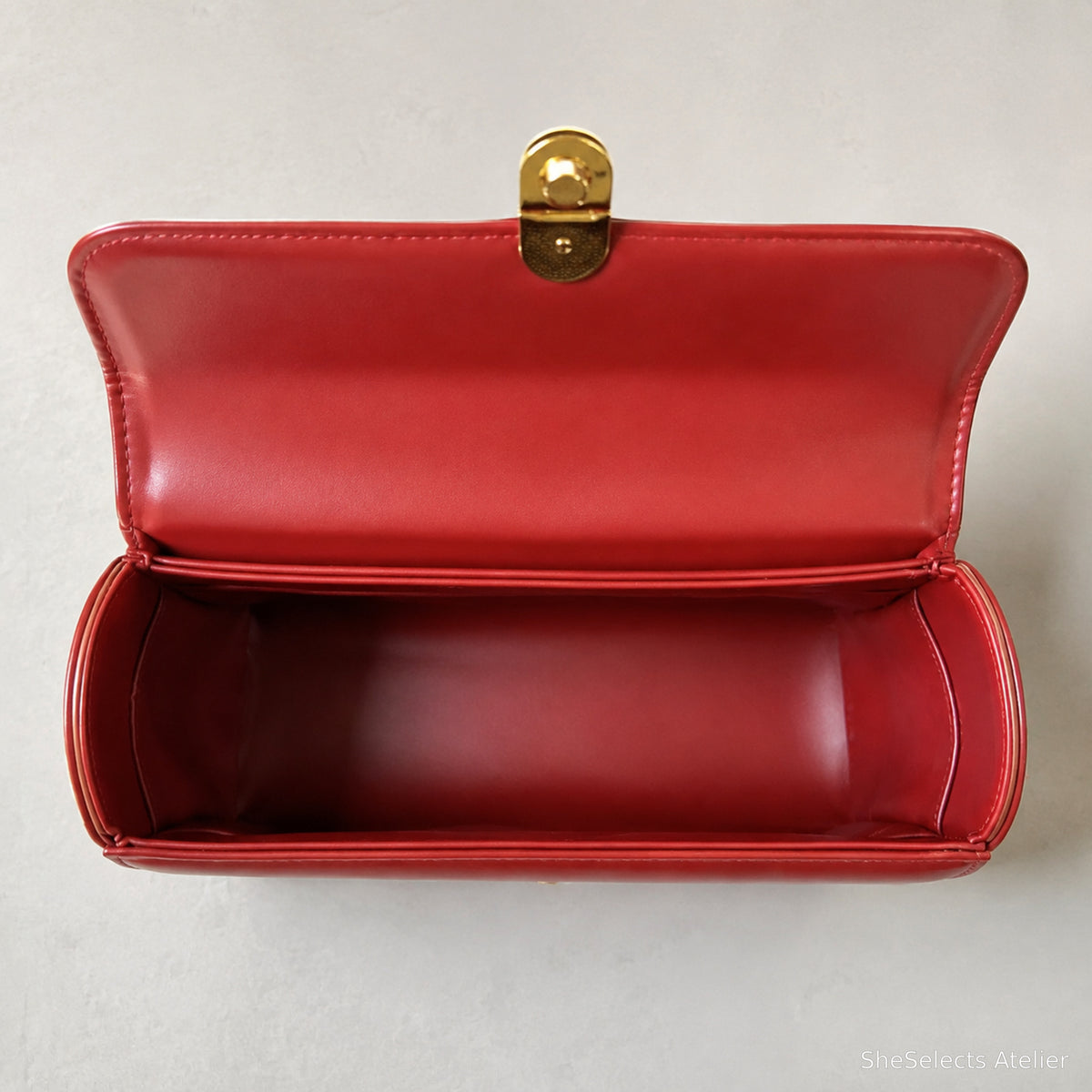 Red handbag verified single-compartment interior view