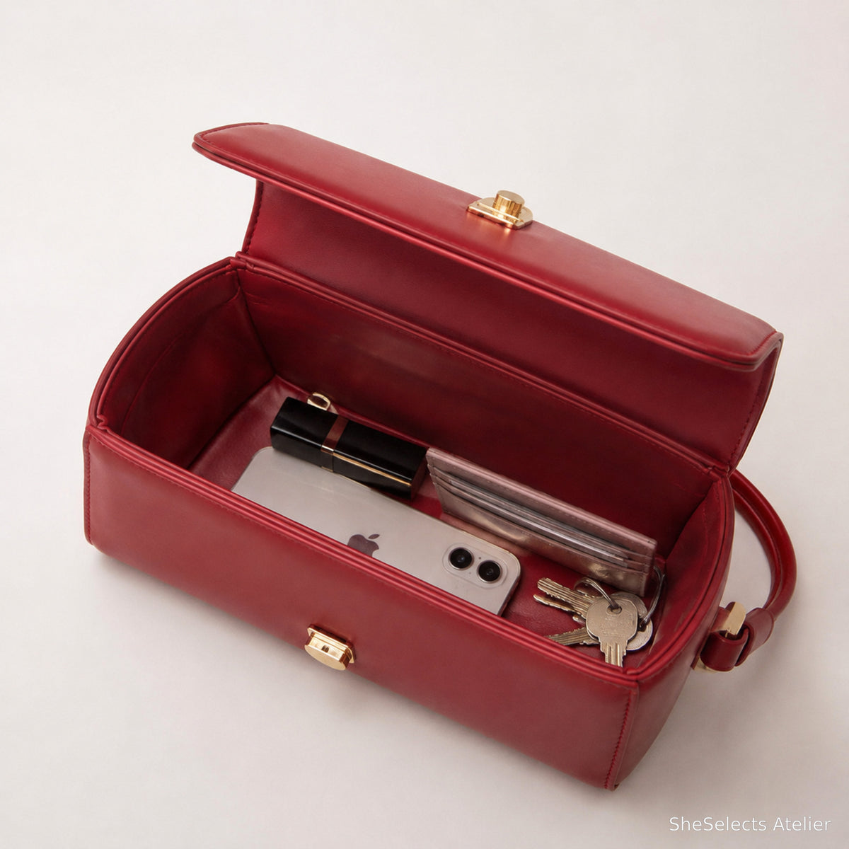 Red purse open capacity view with everyday essentials