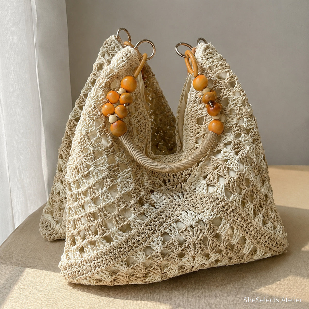 Beige open-weave hobo beach tote with rounded bead handle details