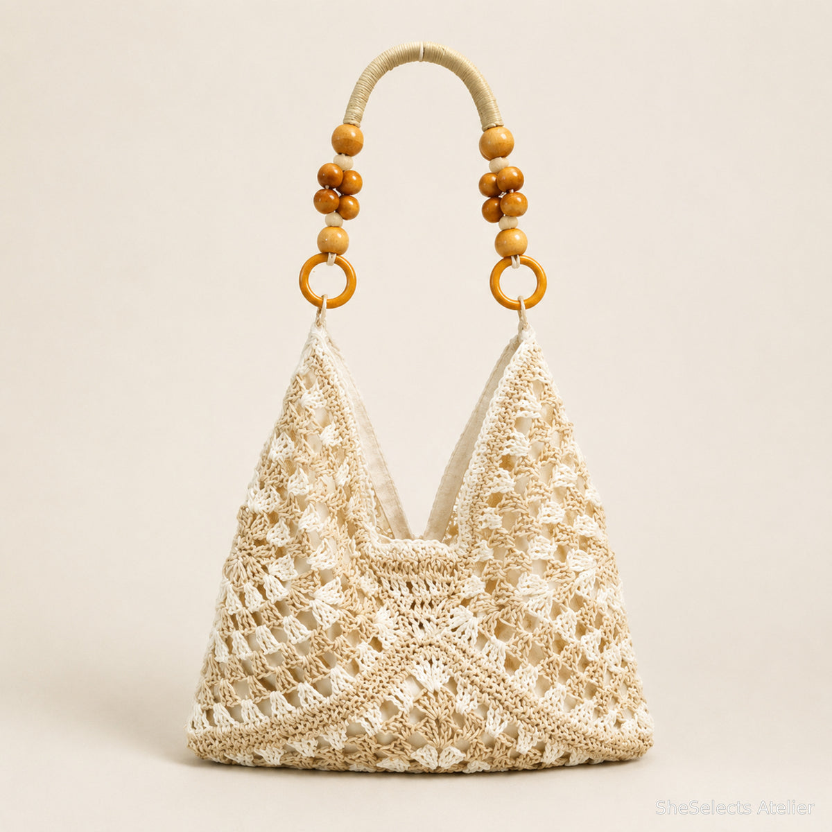 Ivory white open-weave hobo tote with amber bead handle accents