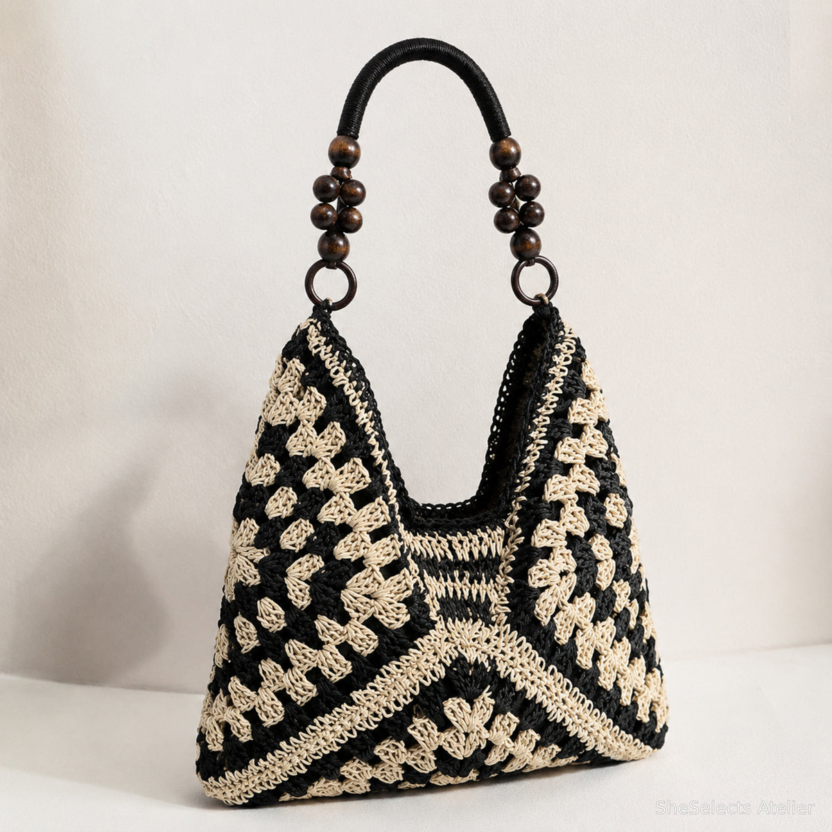 Black and cream geometric woven hobo shoulder bag